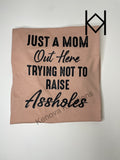 Just a Mom Trying Not to Raise Assholes Tee