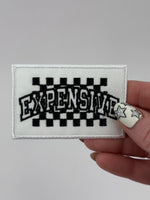 Checkered expensive adhesive patch